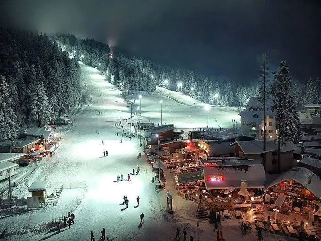 Borovets ski resort at night, with floodlit slopes above the resort centre